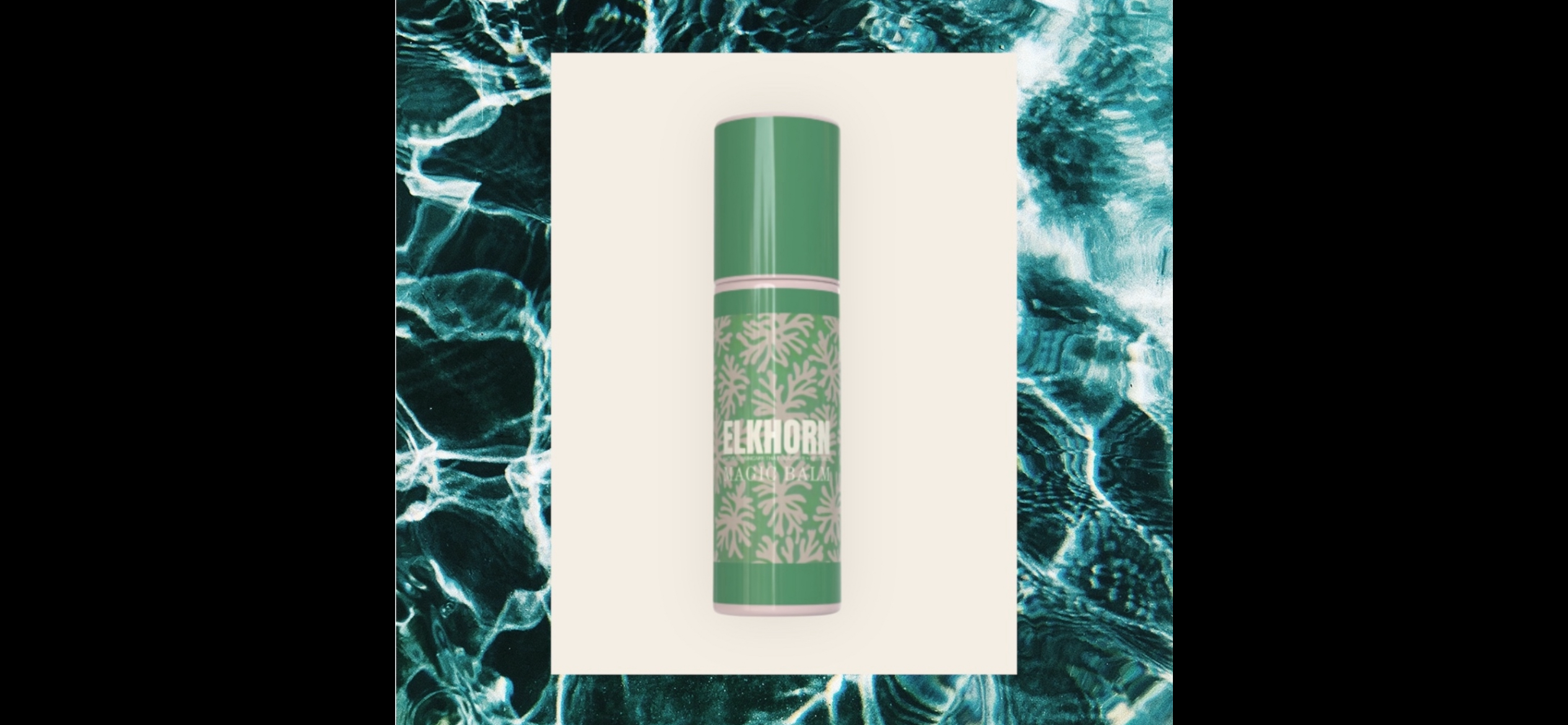 Elkhorn Magic Skin Balm stick against rippling water